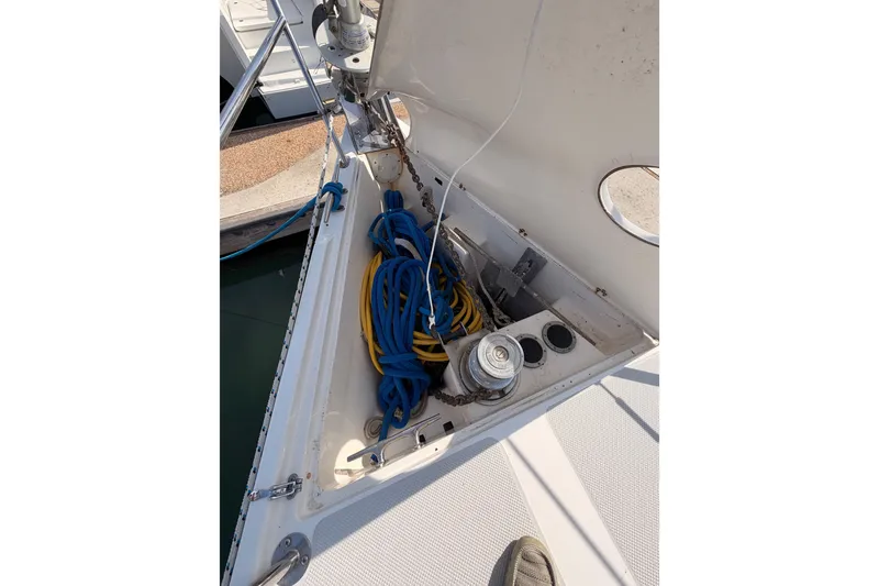 Slide: The Image of Anchor locker of 2005 Catalina 42 MkII sailboat with ropes and winch. - 15