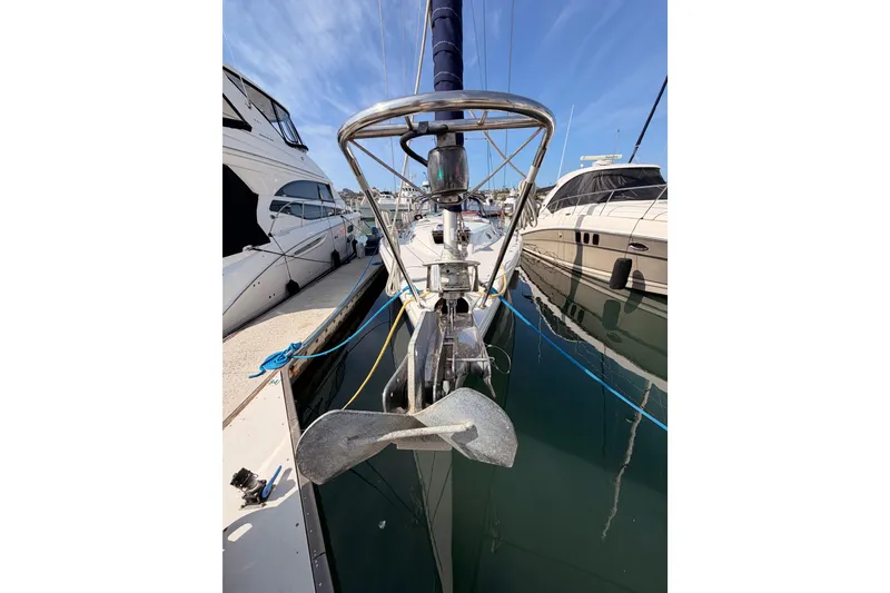 Slide: The Image of 2005 Catalina 42 MkII sailboat docked at marina, front view with anchor. - 2