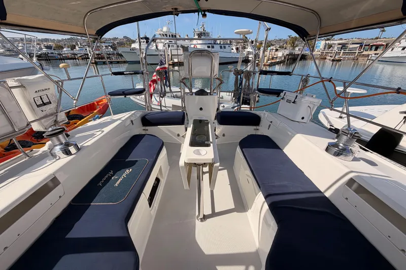 Slide: The Image of Cockpit of 2005 Catalina 42 MkII sailboat with blue seating, docked at marina. - 22
