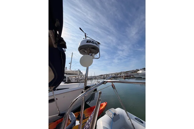 Slide: The Image of Catalina 42 MkII sailboat, 2005 model, docked in marina under clear blue sky. - 24