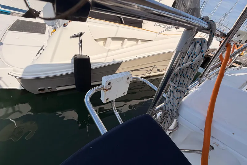 Slide: The Image of Catalina 42 MkII sailboat docked, featuring ropes and fender, 2005 model. - 26