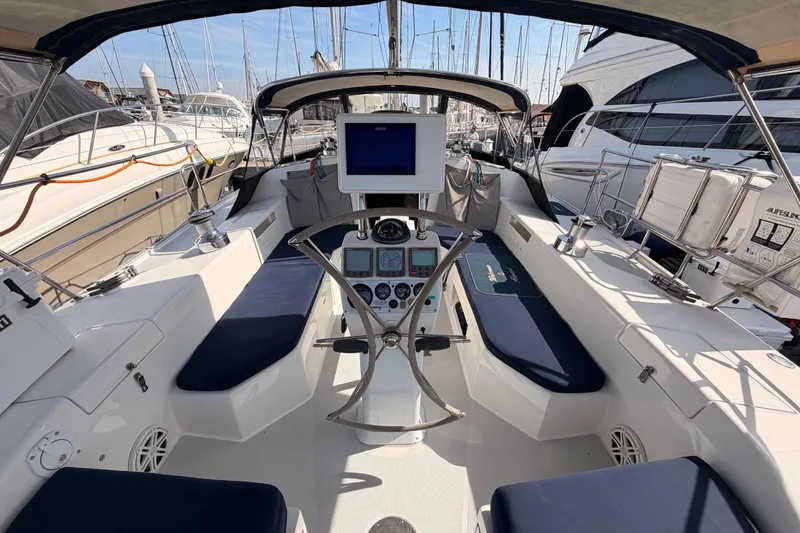 Slide: The Image of Cockpit of 2005 Catalina 42 MkII sailboat with navigation equipment and seating. - 28