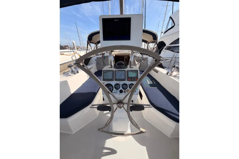 Slide: The Image of Cockpit of 2005 Catalina 42 MkII sailboat with navigation instruments and steering wheel. - 29