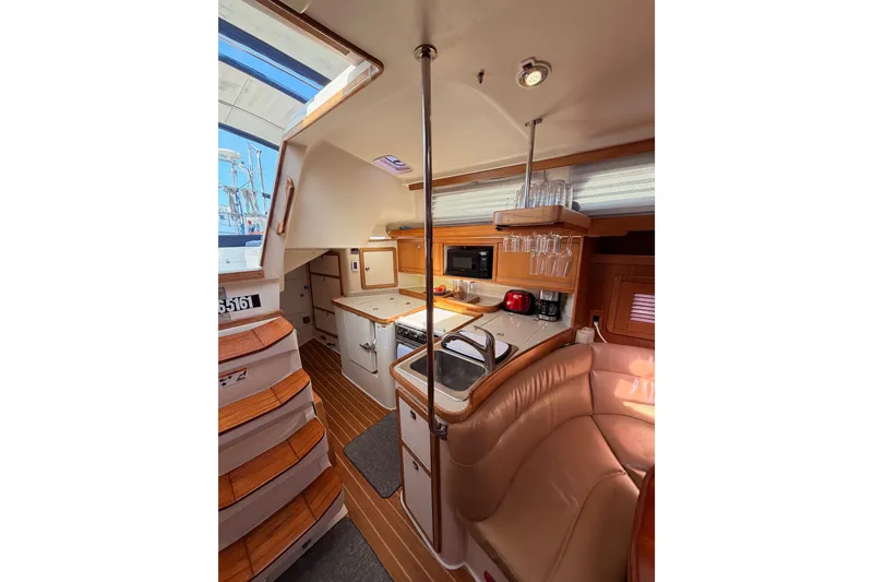 Slide: The Image of Interior of 2005 Catalina 42 MkII sailboat with kitchen and seating area. - 36