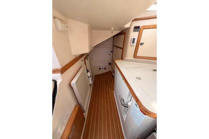 Slide: The Image of 2005 Catalina 42 MkII yacht interior with wood accents and compact design. - 39