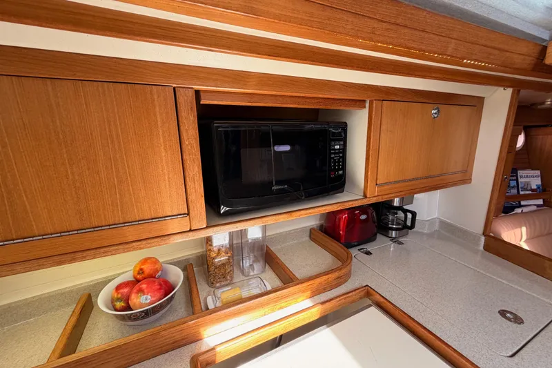 Slide: The Image of Galley of 2005 Catalina 42 MkII sailboat with microwave, fruit bowl, and coffee maker. - 43