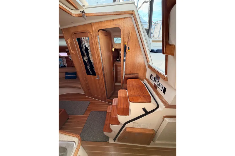 Slide: The Image of Interior of 2005 Catalina 42 MkII sailboat with wooden steps and cabin view. - 47