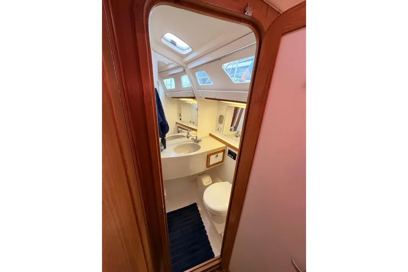 Slide: The Image of Interior of 2005 Catalina 42 MkII yacht bathroom with sink and toilet. - 52