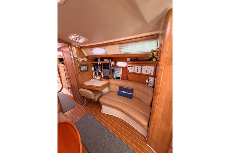 Slide: The Image of Interior of 2005 Catalina 42 MkII sailboat with cozy seating and navigation area. - 55