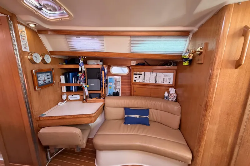 Slide: The Image of Interior of 2005 Catalina 42 MkII sailboat with navigation station and seating area. - 56