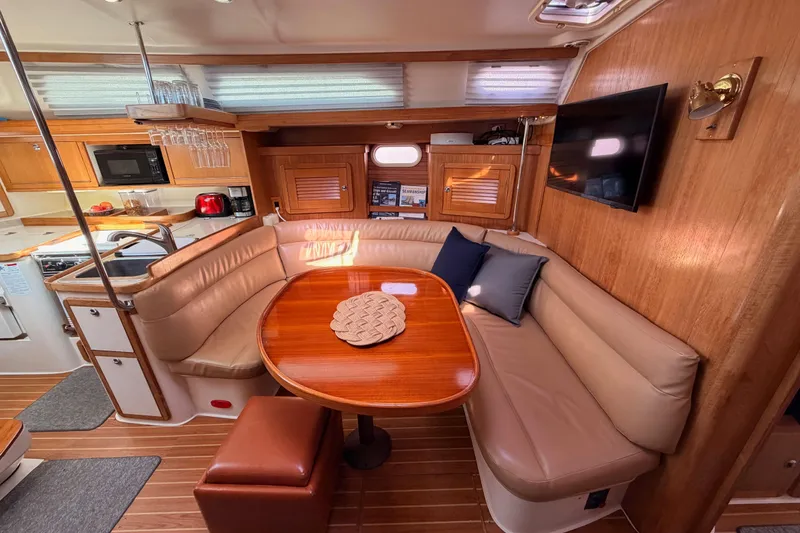 Slide: The Image of Luxurious 2005 Catalina 42 MkII yacht interior with cozy seating and modern amenities. - 57