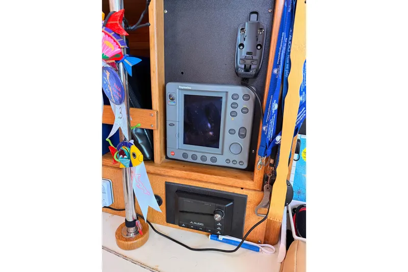 Slide: The Image of Navigation equipment on a 2005 Catalina 42 MkII sailboat, featuring a Raymarine display. - 60