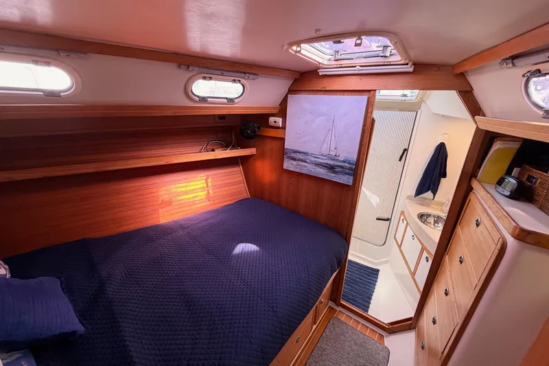 Slide: The Image of Cozy cabin interior of 2005 Catalina 42 MkII sailboat with bed and bathroom. - 65