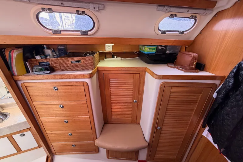 Slide: The Image of 2005 Catalina 42 MkII yacht interior with wooden cabinets and storage compartments. - 67