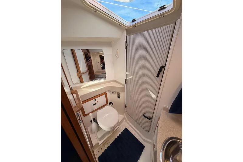 Slide: The Image of Bathroom interior of 2005 Catalina 42 MkII sailboat, featuring compact design and skylight. - 69