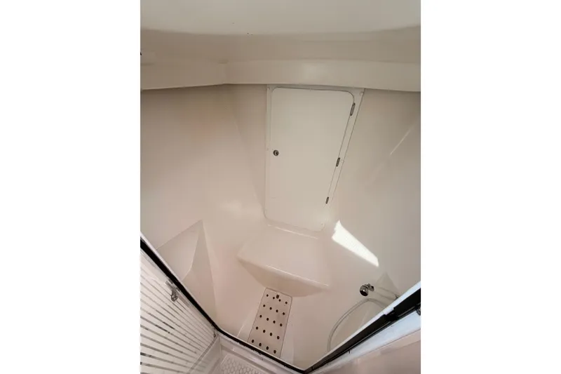 Slide: The Image of Interior of 2005 Catalina 42 MkII sailboat, featuring a compact, white shower area. - 70