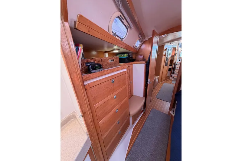 Slide: The Image of Interior of 2005 Catalina 42 MkII sailboat with wooden cabinetry and cozy design. - 74