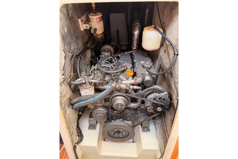 Slide: The Image of Engine compartment of a 2005 Catalina 42 MkII sailboat, showcasing detailed mechanical components. - 79