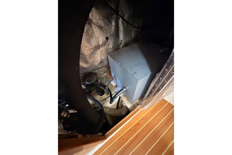 Slide: The Image of Engine compartment of a 2005 Catalina 42 MkII sailboat, showing mechanical components. - 81