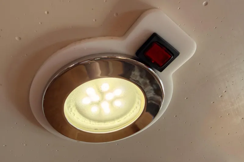 Slide: The Image of Ceiling light with red switch on a 2005 Catalina 42 MkII yacht. - 83