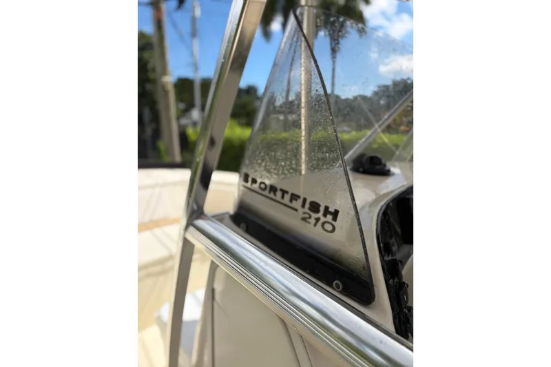 Slide: The Image of Close-up of 2005 Scout 210 Sportfish boat windshield with logo and chrome details. - 10