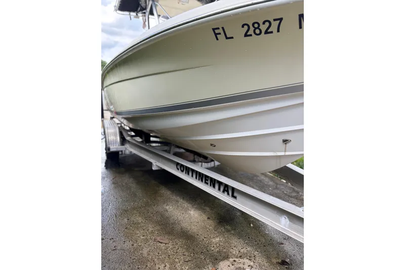 Slide: The Image of 2005 Scout 210 Sportfish boat on Continental trailer, side view. - 2