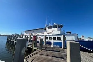 Slide: The Image of 1970 Blount 100 Foot Custom Steel Hull docked - 1