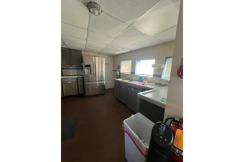 Slide: The Image of 1970 Blount 100 Foot Custom Steel Hull Galley with stainless steel appliances and ample counter space. - 2