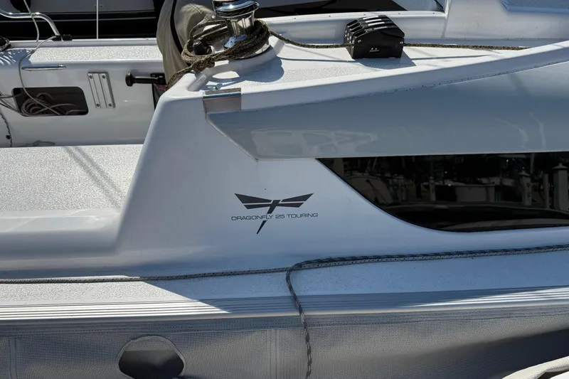 Slide: The Image of 2022 Dragonfly 25 sailboat with logo and deck details. - 12