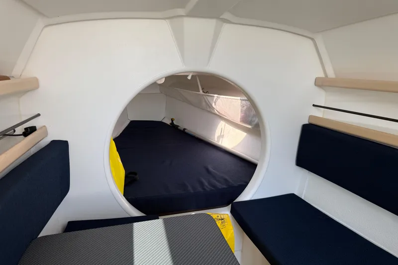 Slide: The Image of Interior cabin of 2022 Dragonfly 25 sailboat with cozy seating and sleeping area. - 22