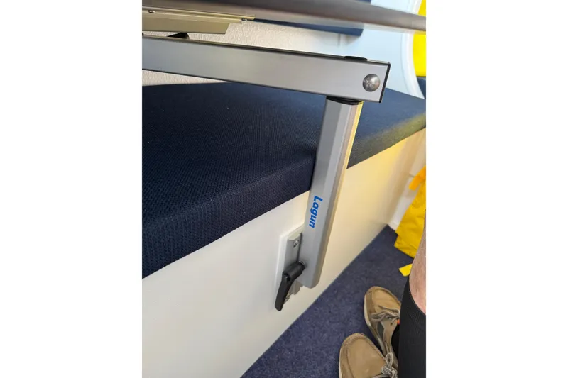 Slide: The Image of Adjustable table leg in a 2022 Dragonfly 25 boat interior. - 30