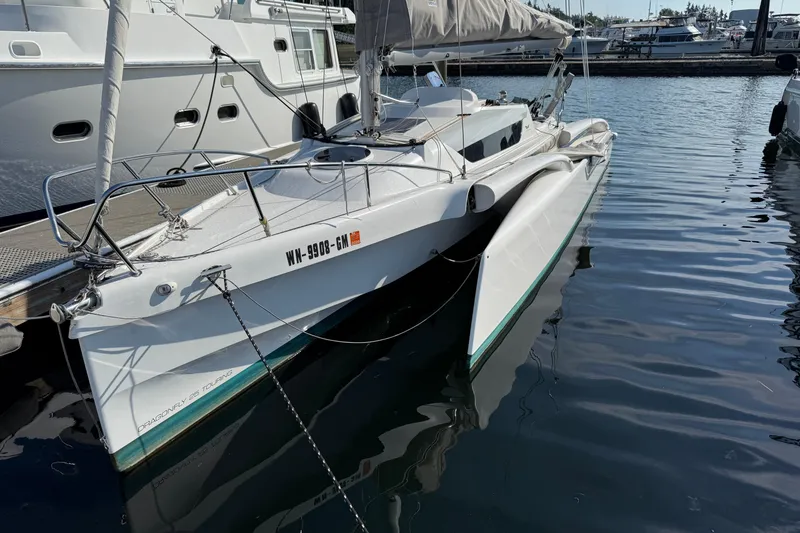 Slide: The Image of 2022 Dragonfly 25 sailboat docked in marina, featuring sleek design and modern amenities. - 6