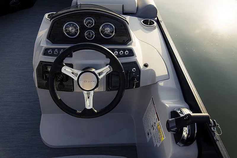 Slide: The Image of Manufacturer Provided Image: 2025 Lowe SS 230 WV boat dashboard with steering wheel and gauges. - 5