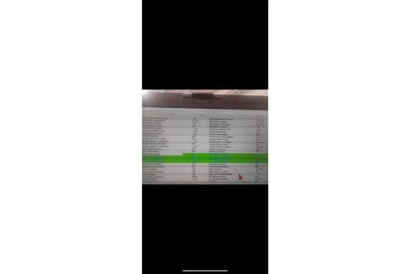 Slide: The Image of Computer screen displaying diagnostic data for a 2004 Rinker 282 BR boat. - 18