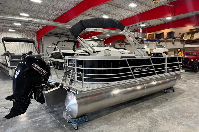 Slide: The Image of 2026 Berkshire 22 UL LE pontoon boat with Mercury engine in showroom. - 3