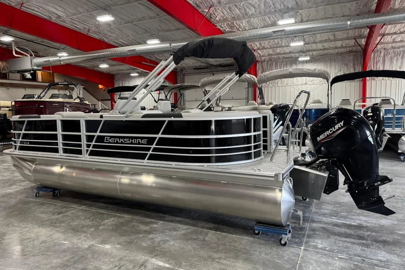 Slide: The Image of 2026 Berkshire 22 UL LE pontoon boat with Mercury engine in showroom. - 4
