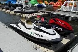 Slide: The Image of 2017 Kawasaki Jet Ski 310L SE docked at marina with other watercraft. - 6