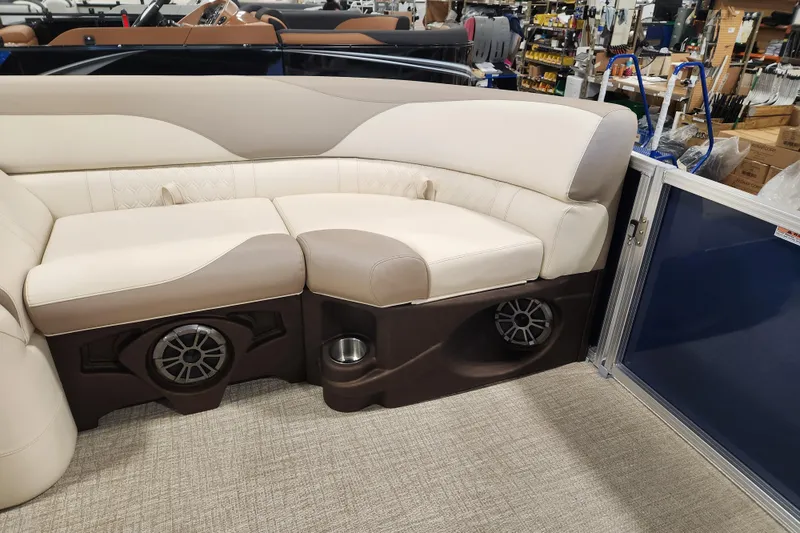 Slide: The Image of 2026 Avalon LSZ Quad Lounger with beige seating and integrated speakers in a showroom. - 7