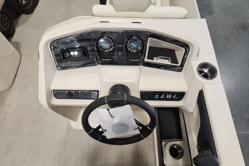 Slide: The Image of 2026 Avalon LSZ Quad Lounger dashboard with steering wheel and control panel. - 8