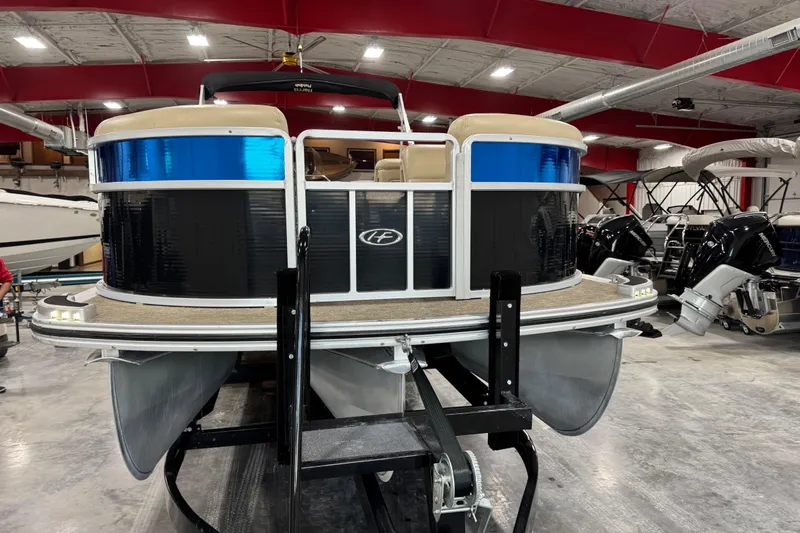 Slide: The Image of 2012 Harris Grand Mariner 250 pontoon boat in showroom, front view. - 5
