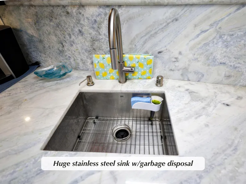 Slide: The Image of Stainless steel sink with garbage disposal on marble countertop, Stephens Motor Yacht 1968. - 12