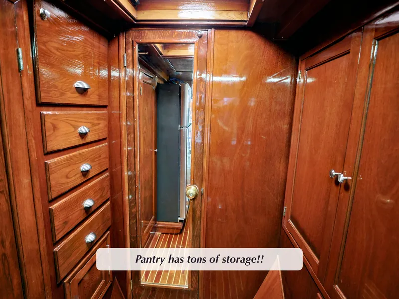 Slide: The Image of Luxurious wooden pantry with ample storage on a 1968 Stephens Motor Yacht. - 13