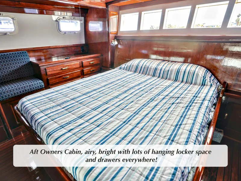 Slide: The Image of Aft owners cabin in 1968 Stephens motor yacht, featuring spacious drawers and bright windows. - 16
