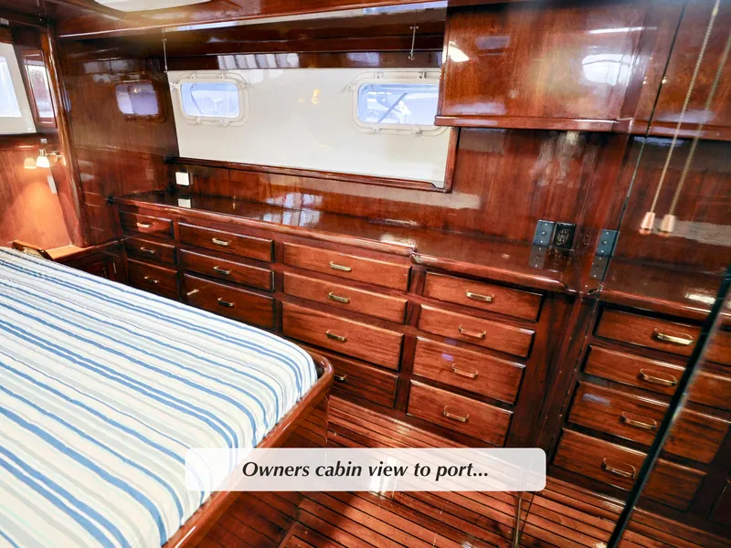 Slide: The Image of Luxurious 1968 Stephens Motor Yacht owner's cabin with rich wood finish and ample storage. - 17