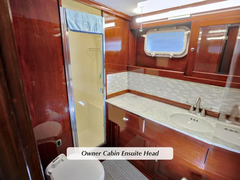 Slide: The Image of Luxurious 1968 Stephens Motor Yacht owner cabin ensuite with elegant wood finish. - 19