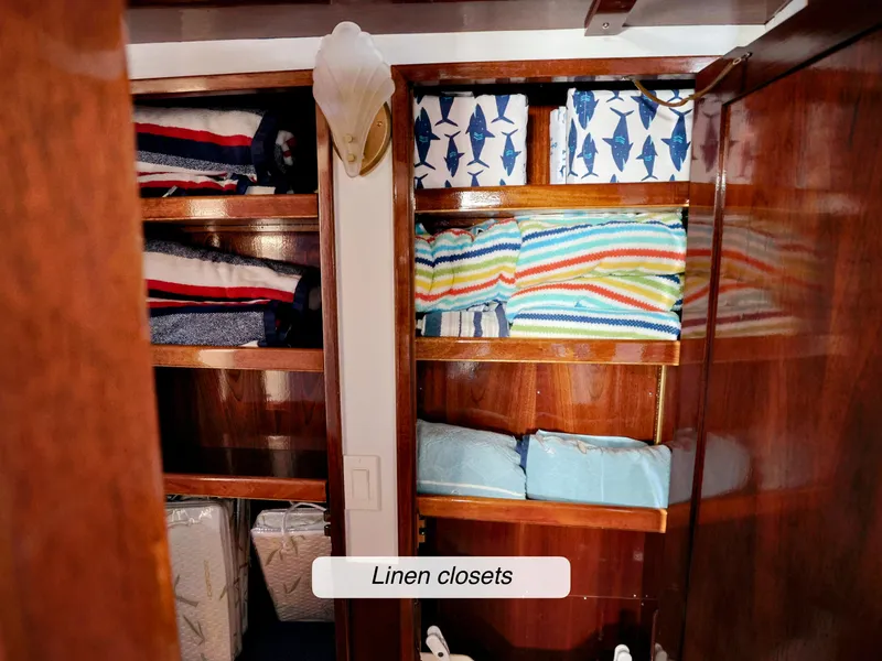 Slide: The Image of Linen closets on a 1968 Stephens Motor Yacht, featuring neatly organized colorful linens. - 27