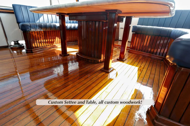 Slide: The Image of 1968 Stephens Motor Yacht interior with custom woodwork settee and table. - 29