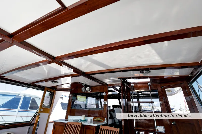 Slide: The Image of Interior of a 1968 Stephens Motor Yacht showcasing elegant woodwork and craftsmanship. - 34