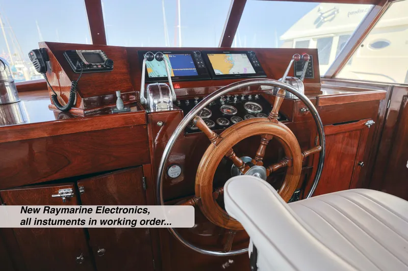 Slide: The Image of 1968 Stephens Motor Yacht helm with new Raymarine electronics and wooden steering wheel. - 36