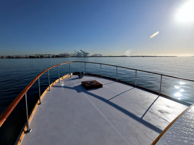 Slide: The Image of 1968 Stephens Motor Yacht deck with ocean view and distant port cranes. - 41